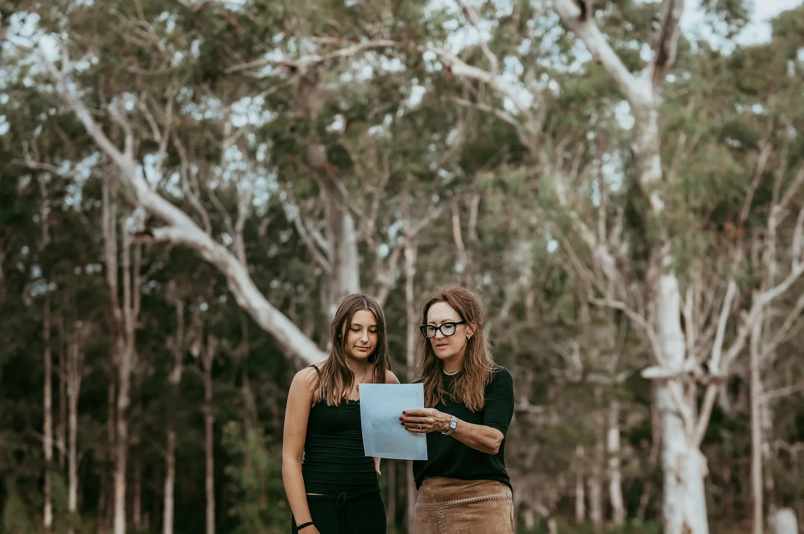 Edwina coaching a young performer through a script outdoors